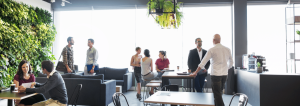 co-workers chatting relaxedly in a networking area in an office