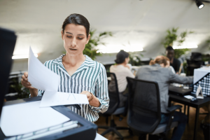 woman printing documents in an office