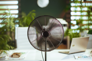 a black cooling fan in an office